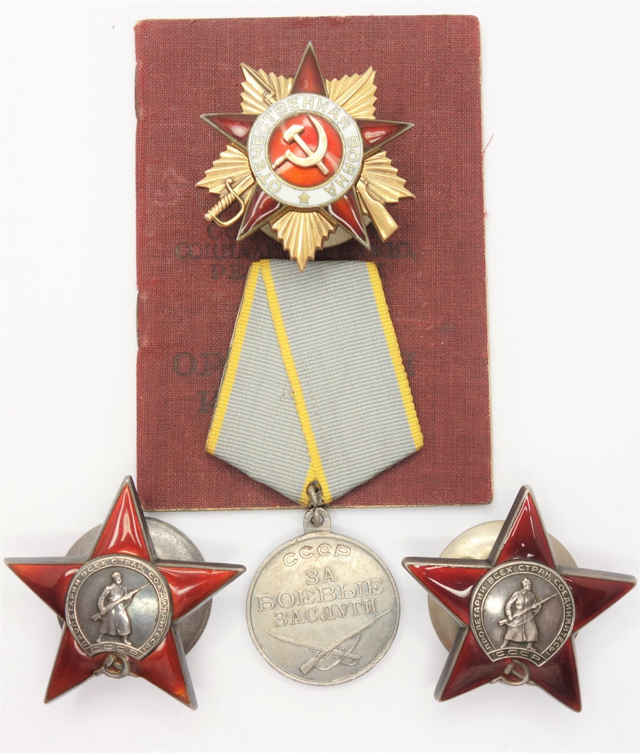 Documented group of an Order of the Patriotic War 1st class #245234, two Red Stars #223621 #3372497 and a Medal for Combat Merit