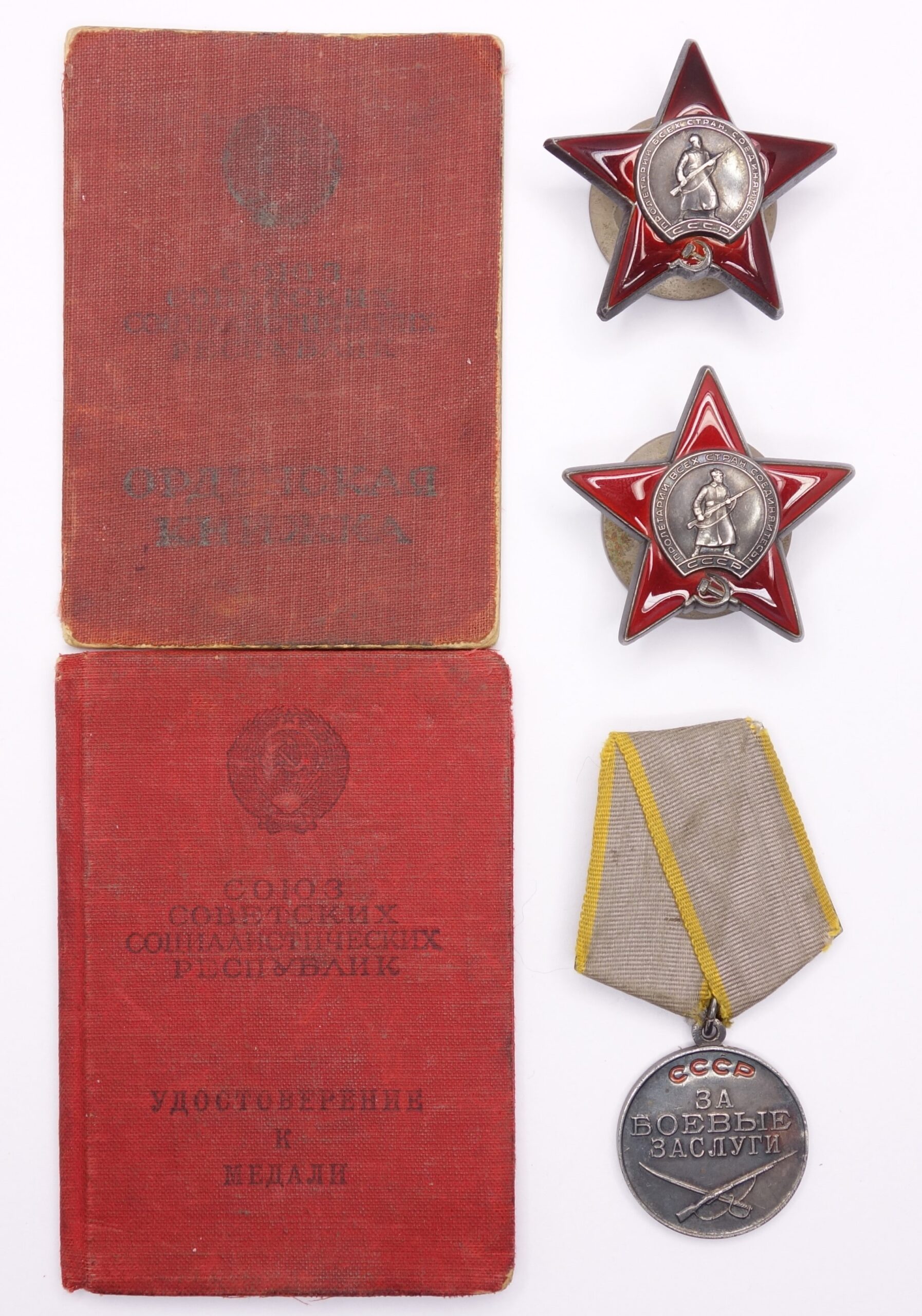 Documented group of two Soviet Orders of the Red Star #1698904 + #3299099 and a Medal for Combat Merit