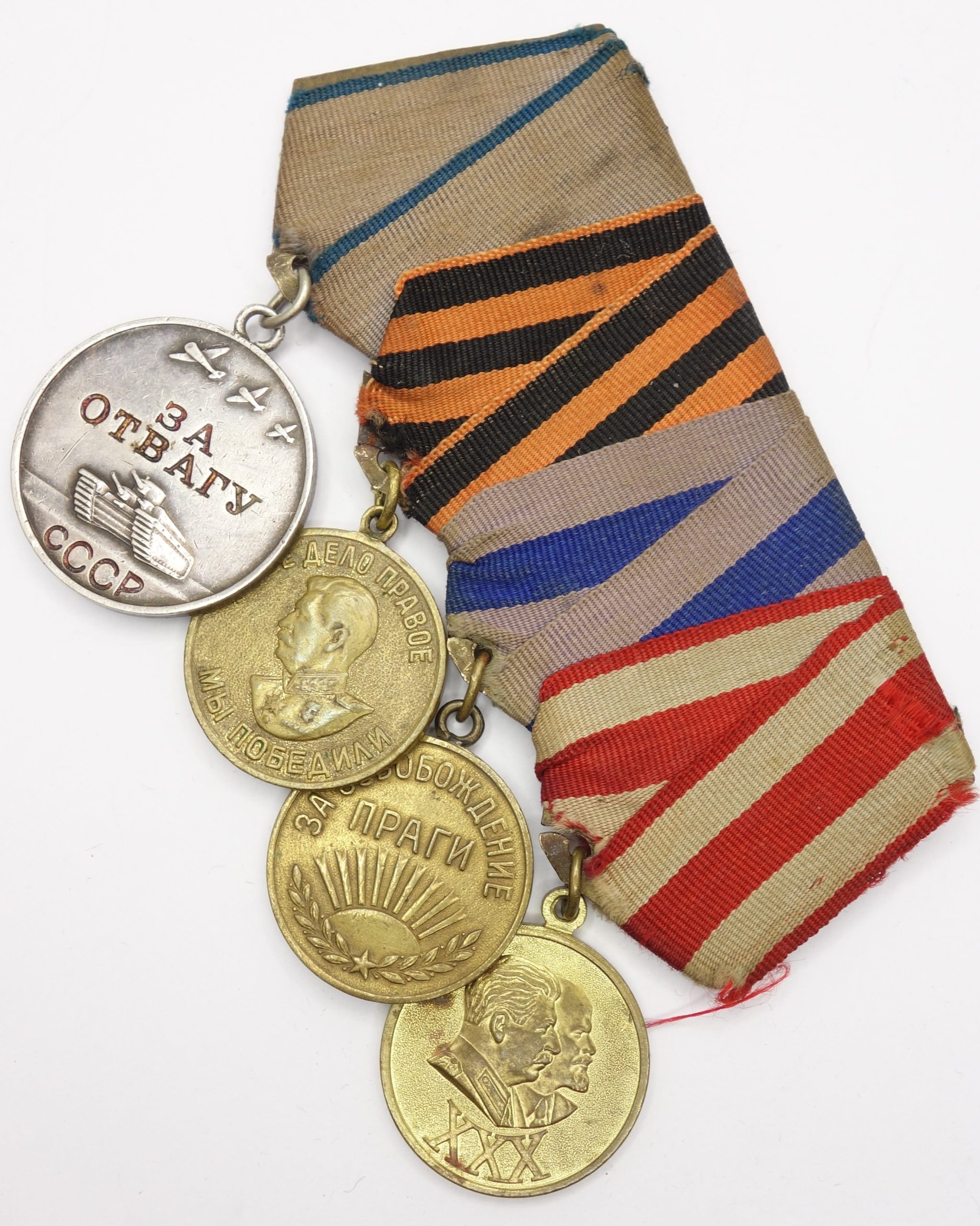 Group of Soviet medals consisting of a Bravery Medal #2598315, Victory over Germany, Liberation of Prague and a 30 years Red Army medal