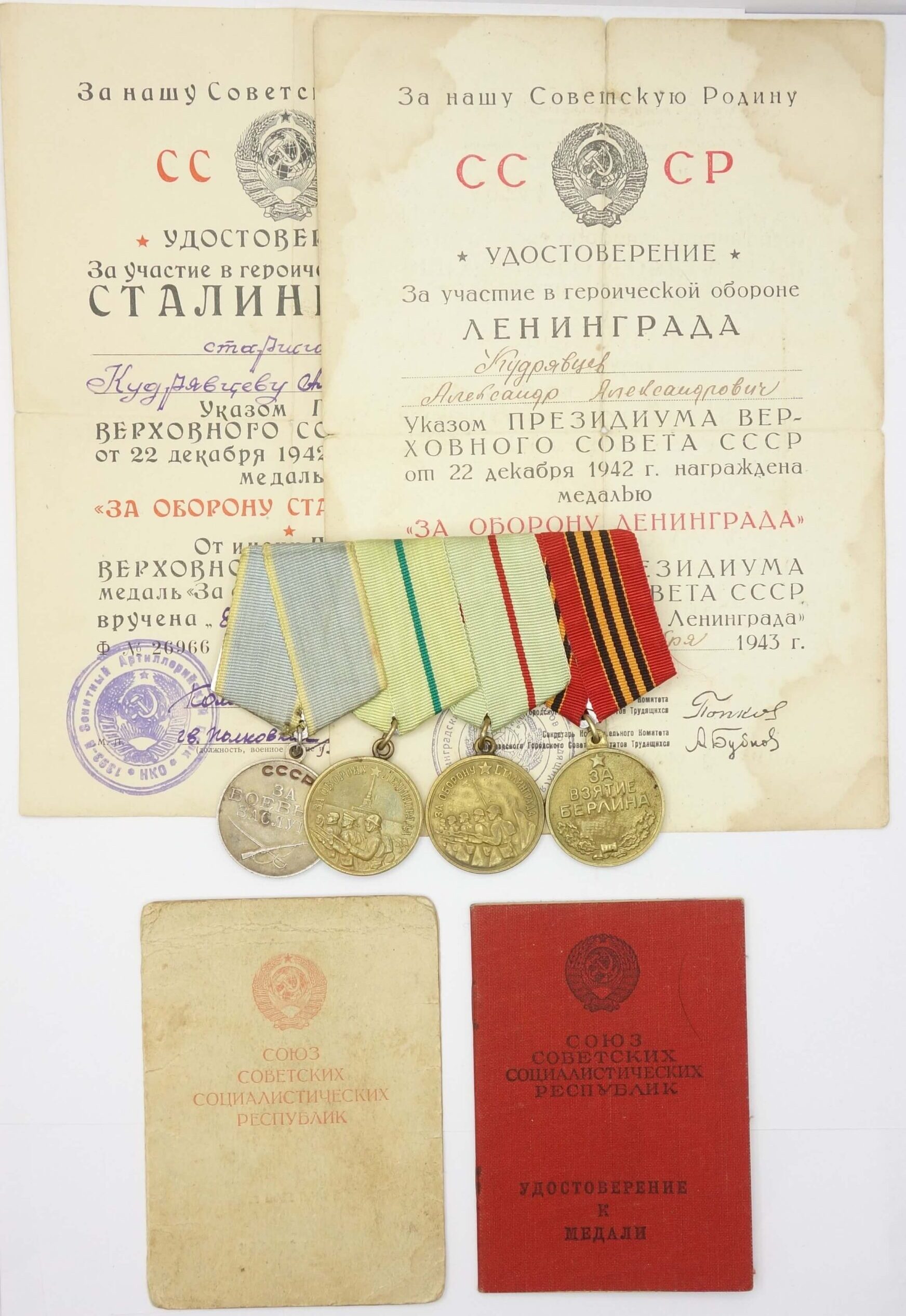 Group of Soviet Medals: Combat Merit, Leningrad, Stalingrad and Berlin with their documents