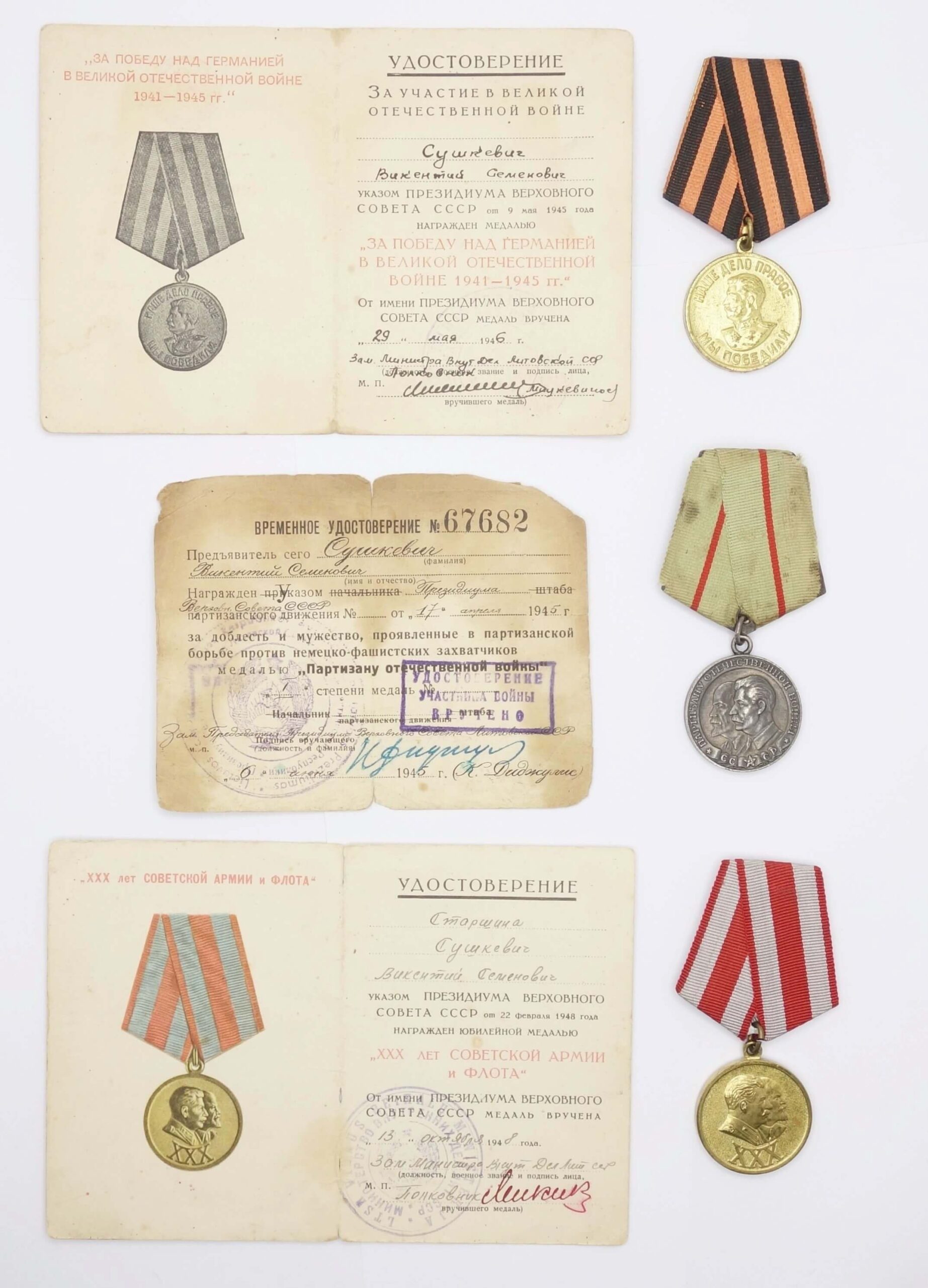 Group of a Partisan medal 1st class, a medal for the Victory over Germany medal and a jubilee medal for 30 Years of the Soviet Army